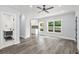 Living room featuring a modern ceiling fan, hardwood floors and an open floor plan at 935 Pelham Nw St, Atlanta, GA 30318