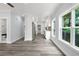 Spacious living room and kitchen with hardwood floors and abundant natural light at 935 Pelham Nw St, Atlanta, GA 30318