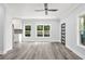 Bright living room featuring hardwood floors, large windows and an open floor plan at 935 Pelham Nw St, Atlanta, GA 30318