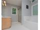 Bright bathroom featuring a large soaking tub and a walk-in shower with gold trim at 1775 Whooping Creek Rd, Carrollton, GA 30116
