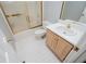 Bathroom featuring a shower with glass door, a toilet, and a vanity with white countertop at 1775 Whooping Creek Rd, Carrollton, GA 30116