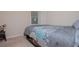 Cozy bedroom with neutral decor, plush carpet, and natural light from the window at 1775 Whooping Creek Rd, Carrollton, GA 30116
