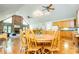 Open-concept dining area adjacent to the kitchen with an adjacent fireplace and hardwood floors at 1775 Whooping Creek Rd, Carrollton, GA 30116