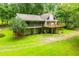 Two story exterior elevation featuring a yard, deck, and balconies at 1775 Whooping Creek Rd, Carrollton, GA 30116