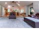 Spacious living room featuring vaulted ceilings, wood floors, and an open layout with a breakfast bar at 1775 Whooping Creek Rd, Carrollton, GA 30116