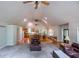 Open living room with high ceilings, connecting the kitchen and dining area for easy entertaining at 1775 Whooping Creek Rd, Carrollton, GA 30116