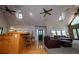 View of open-concept living room with breakfast bar, hardwood floors, and a cozy seating arrangement at 1775 Whooping Creek Rd, Carrollton, GA 30116