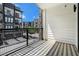 A private balcony with black and white tiled floors and views of the surrounding community at 383 Pratt Se Dr # 503, Atlanta, GA 30315