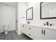 Modern bathroom featuring a double sink vanity, walk-in shower, and patterned tile flooring at 383 Pratt Se Dr # 503, Atlanta, GA 30315
