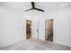 Carpeted bedroom with ceiling fan and access to the kitchen and bathroom at 383 Pratt Se Dr # 503, Atlanta, GA 30315