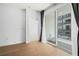 Bright bedroom with hardwood floors and a sliding glass door leading to a balcony at 383 Pratt Se Dr # 503, Atlanta, GA 30315