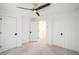 Bright bedroom featuring carpet and ceiling fan with a double door closet at 383 Pratt Se Dr # 503, Atlanta, GA 30315