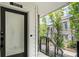 Modern townhome entryway with a secure door and a view of the landscaped exterior at 383 Pratt Se Dr # 503, Atlanta, GA 30315