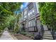 Townhome exterior featuring brick facade, landscaping, and a sidewalk path to the entrance at 383 Pratt Se Dr # 503, Atlanta, GA 30315