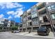 Modern townhome exterior featuring brick accents, private balconies, and convenient garage parking at 383 Pratt Se Dr # 503, Atlanta, GA 30315