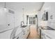 Modern kitchen with white cabinets, stainless appliances, quartz countertops, and black hardware at 383 Pratt Se Dr # 503, Atlanta, GA 30315