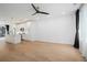 Bright and airy living space with modern lighting, hardwood floors, and a view into the kitchen at 383 Pratt Se Dr # 503, Atlanta, GA 30315