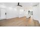 Open-concept living area with hardwood floors seamlessly transitioning into a modern kitchen at 383 Pratt Se Dr # 503, Atlanta, GA 30315