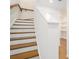 Elegant staircase with wooden treads and white risers, complemented by a modern handrail and bright, open space at 383 Pratt Se Dr # 503, Atlanta, GA 30315