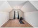 Finished attic space, carpeted and complete with a yoga mat and exercise ball at 6918 Diamond Dr, Rex, GA 30273