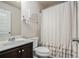Full bathroom with neutral walls, vanity, sink, toilet, and shower with tub at 6918 Diamond Dr, Rex, GA 30273