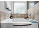 Modern bathroom features a bathtub with shower and tiled walls at 6918 Diamond Dr, Rex, GA 30273