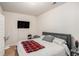 This bedroom features carpet flooring, a ceiling fan, and a TV at 6918 Diamond Dr, Rex, GA 30273