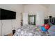 Modern bedroom with a large TV, connected to the Primary bathroom at 6918 Diamond Dr, Rex, GA 30273