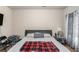 This bedroom features carpet flooring, modern curtains, and a ceiling fan at 6918 Diamond Dr, Rex, GA 30273