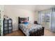 Bright bedroom with a large window, carpeted floors, and a comfortable bed at 6918 Diamond Dr, Rex, GA 30273