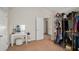 This dressing room offers access to a walk-in closet and vanity at 6918 Diamond Dr, Rex, GA 30273