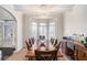 Elegant dining room with a modern chandelier, hardwood floors, and natural light at 6918 Diamond Dr, Rex, GA 30273