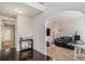 Open foyer with hardwood floors flowing into a living room with comfortable seating at 6918 Diamond Dr, Rex, GA 30273
