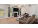 Comfortable living room with a fireplace, neutral carpet, and plenty of seating at 6918 Diamond Dr, Rex, GA 30273