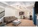 Open-concept living room with a fireplace, coffered ceiling, and seamless flow to the kitchen at 6918 Diamond Dr, Rex, GA 30273