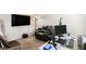 Well-appointed home office with recliner, desk, computer and modern decor at 6918 Diamond Dr, Rex, GA 30273