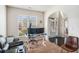 Home office area with a large window, modern desk setup, and comfortable seating at 6918 Diamond Dr, Rex, GA 30273