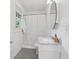 A cozy bathroom featuring marble top vanity, black and white tile flooring, and a tub/shower combo at 1026 Saint Charles Ne Ave # 8, Atlanta, GA 30306