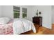 This bedroom features a bright, cozy atmosphere with gleaming hardwood floors and natural light at 1026 Saint Charles Ne Ave # 8, Atlanta, GA 30306