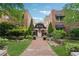 Charming brick apartment building with inviting landscaping and a walkway leading to the entrance at 1026 Saint Charles Ne Ave # 8, Atlanta, GA 30306