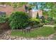 A cozy courtyard is decorated with lush landscaping and a seating area at 1026 Saint Charles Ne Ave # 8, Atlanta, GA 30306