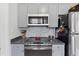 Compact kitchen with stainless steel appliances and stylish backsplash at 1026 Saint Charles Ne Ave # 8, Atlanta, GA 30306