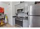 A well-appointed kitchen with stainless steel appliances and gray cabinets offer ample storage at 1026 Saint Charles Ne Ave # 8, Atlanta, GA 30306