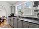 Bright, cozy kitchen showcasing a window, sink, dishwasher and open floor plan at 1026 Saint Charles Ne Ave # 8, Atlanta, GA 30306