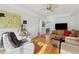 Bright living room featuring hardwood floors, neutral paint, and comfortable seating at 1026 Saint Charles Ne Ave # 8, Atlanta, GA 30306