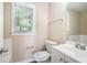 Bright bathroom featuring neutral walls, a single sink vanity and a toilet at 1107 Leslie Pl, Lithonia, GA 30058