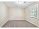 Cozy bedroom with neutral walls and carpet at 1107 Leslie Pl, Lithonia, GA 30058