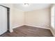 This bedroom has wood floors, a ceiling fan, a window, and a closet at 1107 Leslie Pl, Lithonia, GA 30058