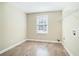 This bedroom has wood floors, a ceiling fan, and a window at 1107 Leslie Pl, Lithonia, GA 30058