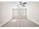 Spacious bedroom with carpet, ceiling fan and natural light at 1107 Leslie Pl, Lithonia, GA 30058